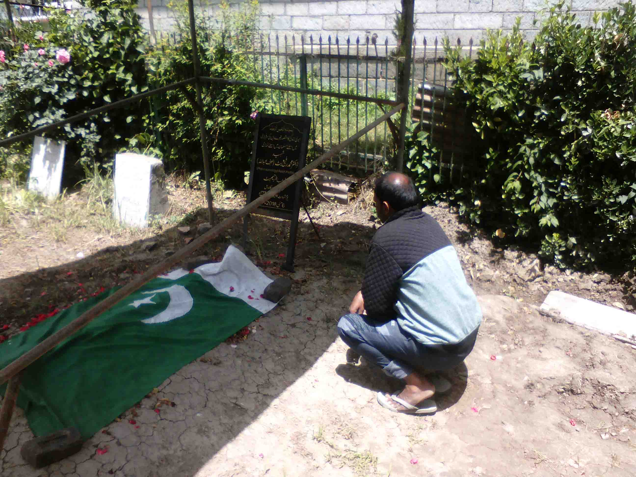 Raafis childhood friend Javaid Ahmad Shah near his grave at Chunduna in Ganderbal.picUbeer Naqushbandi